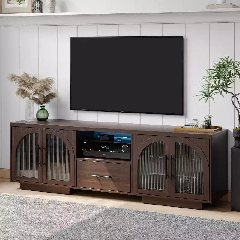 Meuble TV 70" pour téléviseurs 80", meuble de divertissement avec lumières LED et portes vitrées cintrées